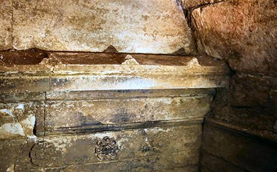 Inner wall of the vestibule of the lion tomb at Amphipolis with a simulated roof edge and rosettes