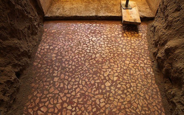 New marble chip floor surface inside the tomb