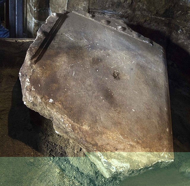 Door fragment as found suspended in sand fill.